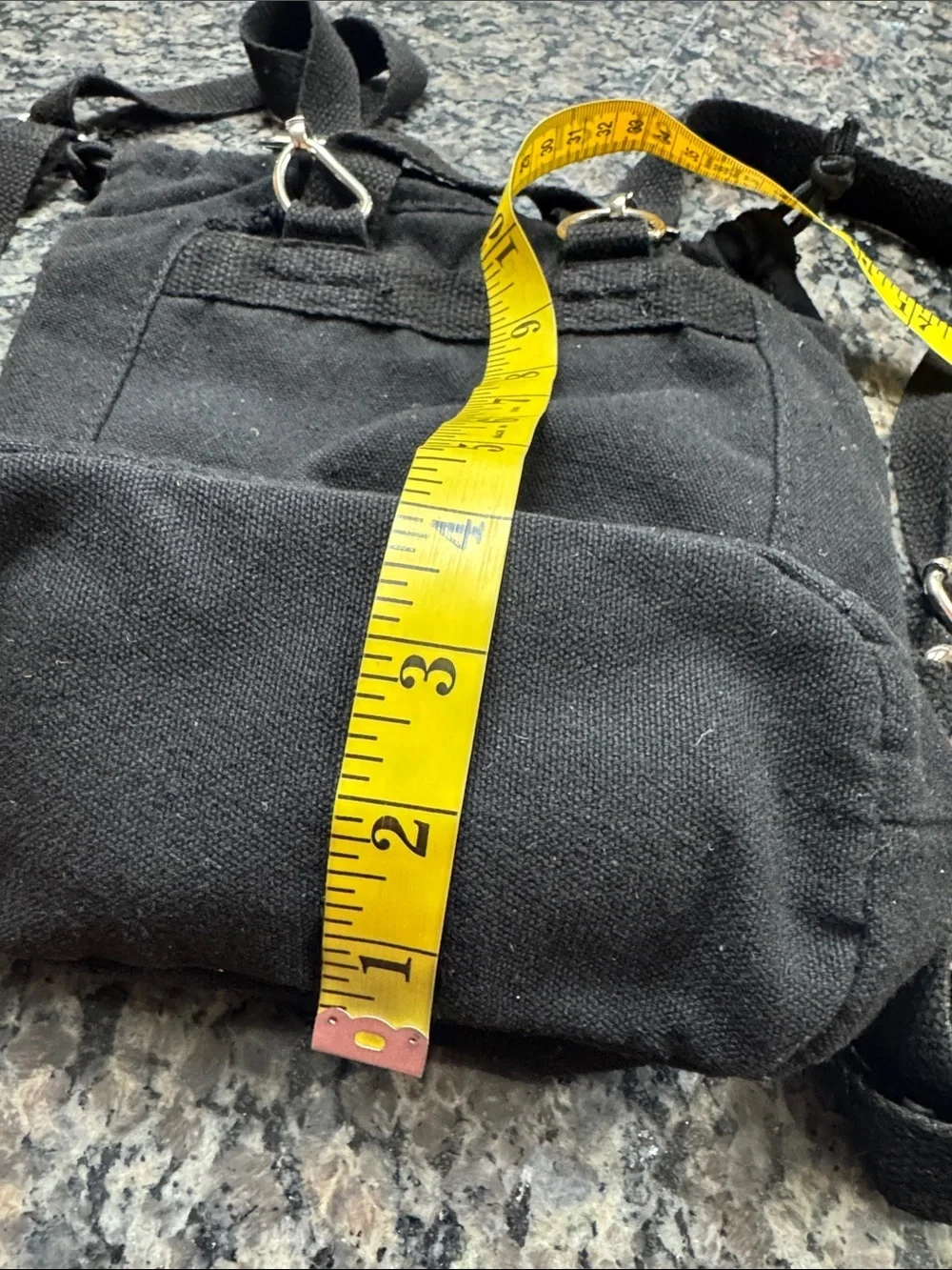 Madden Girl Black Canvas Drawstring Backpack with Front Zip Pocket